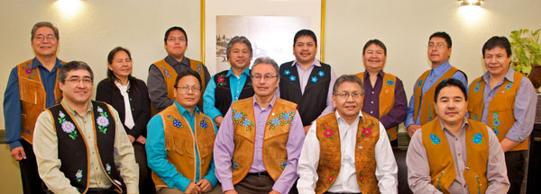 Back row from left to right Assembly Members - Noel Bishop, Rosa Mantla, Robin Laboline, Joseph Judas, George Nitsiza, Sonny Zoe, Garry Bekale, Henry Gon. Front row from left to right - Chief Clifford Daniels,  Chief Johnny Arrowmaker, Grand Chief Eddie Erasmus, Chief Alfonz Nitsiza & Chief David Wedawin